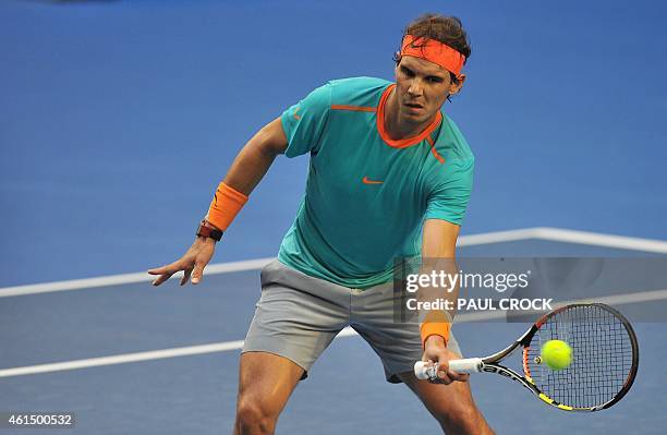 Rafael Nadal of Spain hits a return during a training session ahead of the Australian Open tennis tournament in Melbourne on January 14, 2015. AFP...