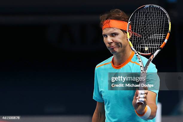 Rafael Nadal of Spain walks off the court with broken strings on his racquet during a practice session ahead of the 2015 Australian Open at Melbourne...