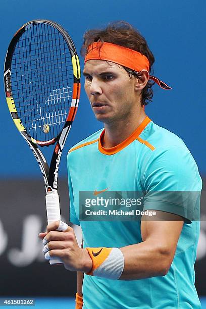Rafael Nadal of Spain walks off the court with broken strings on his racquet during a practice session ahead of the 2015 Australian Open at Melbourne...