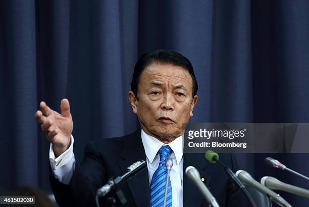 Taro Aso, Japan's deputy prime minister and finance minister, speaks during a news conference in Tokyo, Japan, on Wednesday, Jan. 14, 2015. Japan...