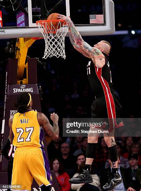 Chris Andersen of the Miami Heat dunks over Jordan Hill of the Los Angeles Lakers at Staples Center on January 13, 2015 in Los Angeles, California....