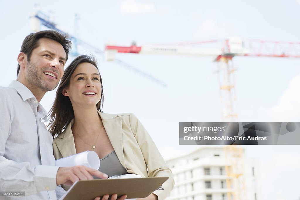Architects surveying constrution project