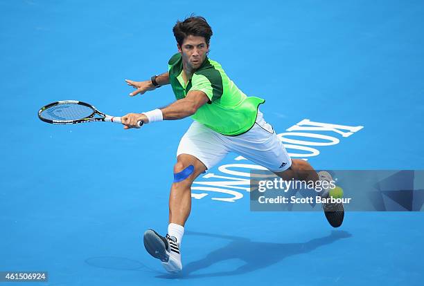 Fernando Verdasco of Spain plays a forehand during his match against Gilles Simon of France during day two of the Priceline Pharmacy Classic at...