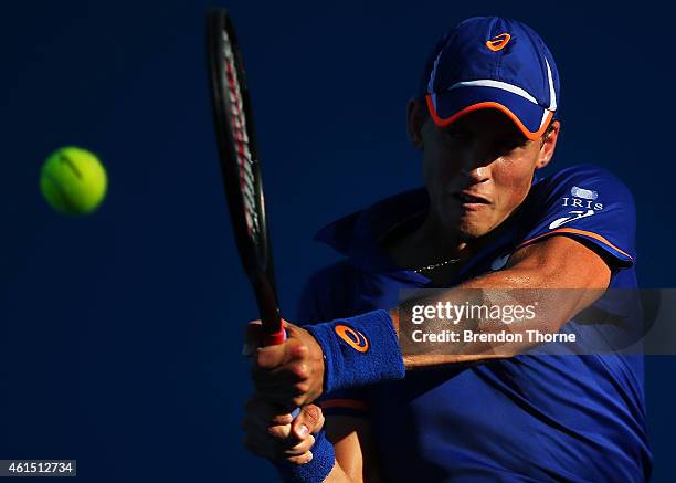 Vasek Pospisil of Canada plays a backhand in his second round match against Julien Benneteau of France during day four of the 2015 Sydney...