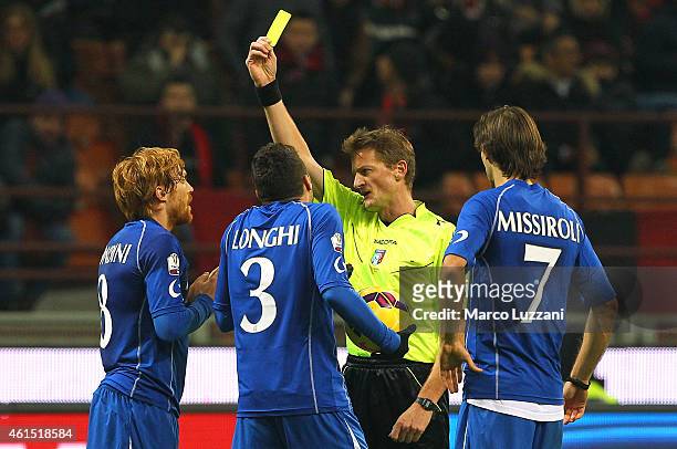 Referee Dino Tommasi shows the yellow card to Davide Biondini of US Sassuolo Calcio during the TIM Cup match between AC Milan and US Sassuolo Calcio...