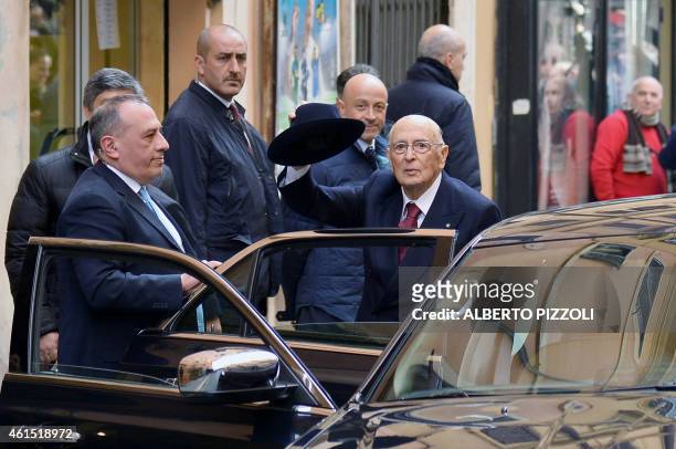 Italian President Giorgio Napolitano waves as he arrives in his private appartment in Rome on January 14, 2015. Italy's veteran president resigned on...