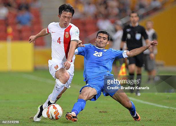 Jiang Zhipeng of China is challenged by Akmal Shorakhmedov of Uzbekistan during the 2015 Asian Cup match between China PR and Uzbekistan at Suncorp...