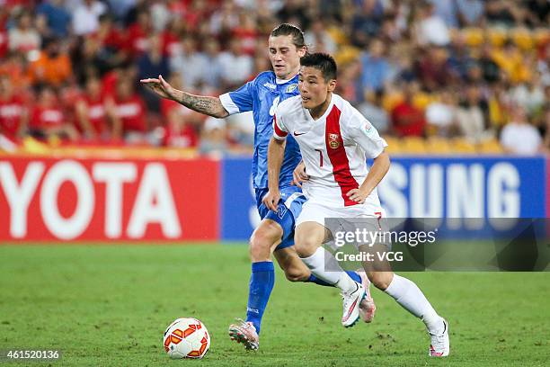 Wu Lei of China competes the ball with Server Djeparov of Uzbekistan during the 2015 Asian Cup match between China PR and Uzbekistan at Suncorp...