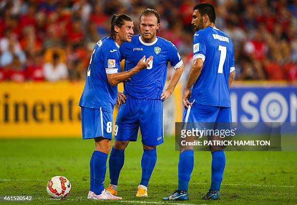 Server Djeparov , Odil Akhmedov and Azizbek Haydarov of Uzbekistan during the first round Asian Cup soccer match between China and Uzbekistan at the...