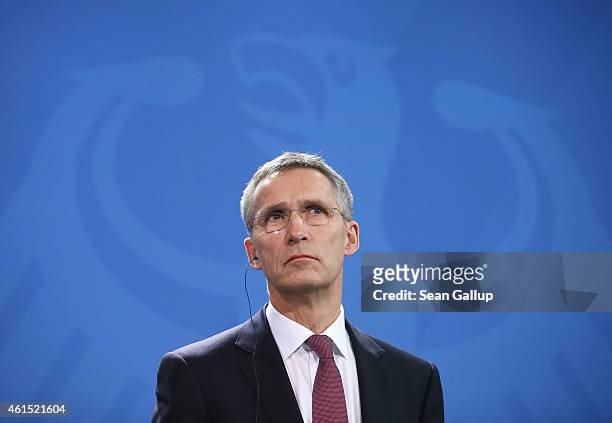 Secretary General Jens Stoltenberg speaks to the media with German Chancellor Angela Merkel following talks at the Chancellery on January 14, 2015 in...