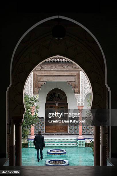 Muslim man walks through the Grand Mosque on January 9, 2015 in Paris, France. Copies of the controversial Charlie Hebdo magazine went on sale today...