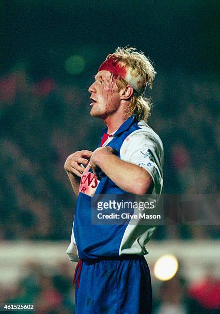 Blackburn Rovers defender Colin Hendry reacts whilst sporting a blood infused head bandage after an earlier incident during a FA Premiership match...