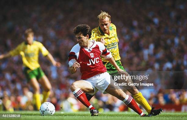 Arsenal wing Anders Limpar holds off the challenge of Jeremy Goss during a FA Premier League match between Arsenal and Norwich City at Higbury on...