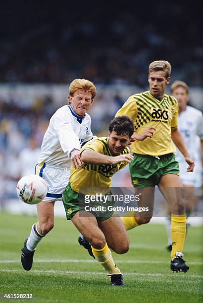 Leeds United player Gordon Strachan challenges Norwich defender Mark Bowen during a League Division One match on August 1, 1990 in Leeds, England.