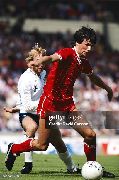 Liverpool defender Alan Hansen holds off the challenge of Spurs striker Steve Archibald during the 1982 FA Charity Shield at Wembley Stadium on...