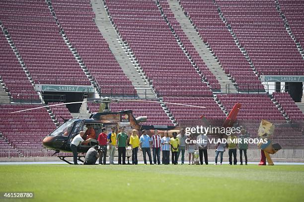 People wearing the jerseys of the participating national football teams, plus the official mascot Zincha and Marcelo Salas , ambassador of the Copa...