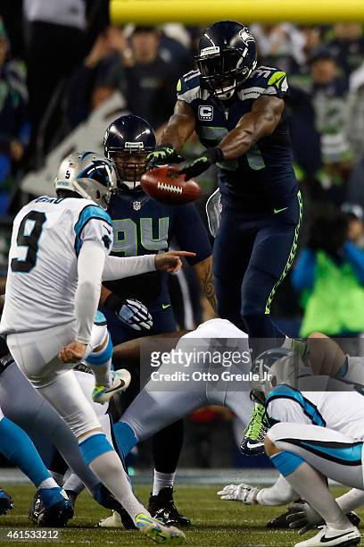 Kam Chancellor of the Seattle Seahawks blocks Graham Gano of the Carolina Panthers but gets called for roughing the kicker in the second quarter...