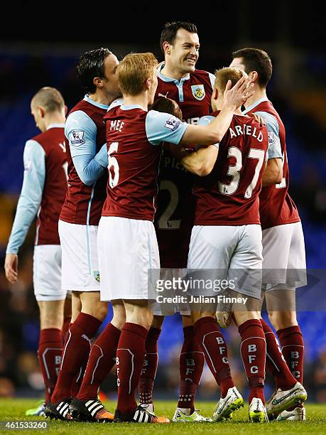 Ross Wallace of Burnley celebrates with team mates as he scores their second goal during the FA Cup Third Round Replay match between Tottenham...