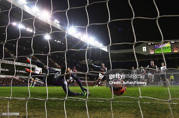 Goalkeeper Michel Vorm of Spurs fails to stop Ross Wallace of Burnley from scoring their second goal during the FA Cup Third Round Replay match...
