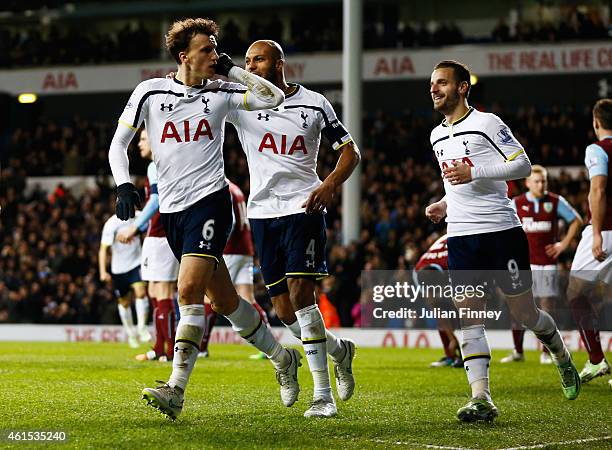 Vlad Chiriches of Spurs celebrates with team mates as he scores their third goal during the FA Cup Third Round Replay match between Tottenham Hotspur...