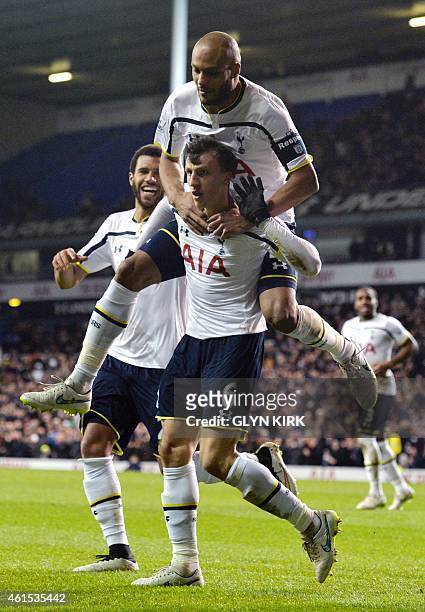 Tottenham Hotspur's Romanian defender Vlad Chiriches celebrates scoring his team's third goal during the English FA Cup Third Round football match...