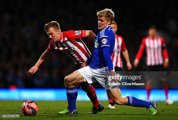 Jonathan Parr of Ipswich battles for the ball with James Ward-Prowse of Southampton during the FA Cup third round replay match between Ipswich Town...