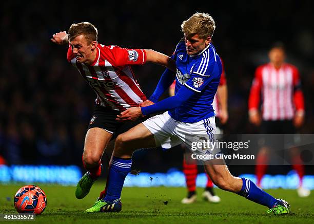 Jonathan Parr of Ipswich battles for the ball with James Ward-Prowse of Southampton during the FA Cup third round replay match between Ipswich Town...