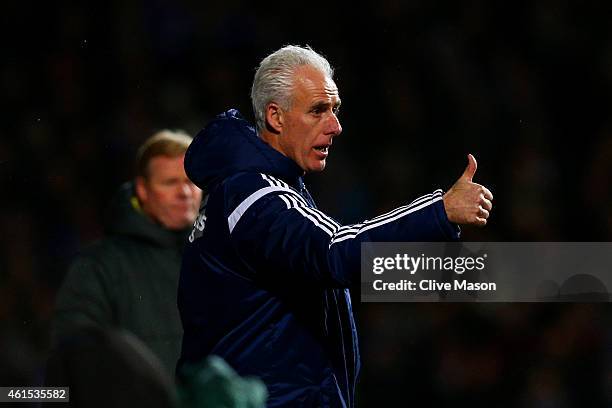 Mick McCarthy, manager of Ipswich gives a thumbs up to his players during the FA Cup third round replay match between Ipswich Town and Southampton at...