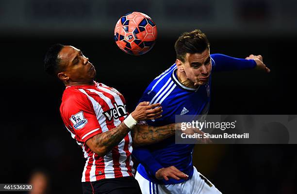 Nathaniel Clyne of Southampton jumps for the ball with Balint Bajner of Ipswich during the FA Cup third round replay match between Ipswich Town and...