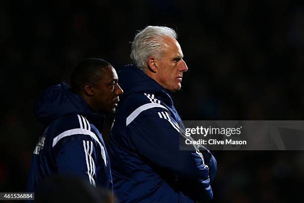 Mick McCarthy, manager of Ipswich looks on next to assistant manager Terry Connor during the FA Cup third round replay match between Ipswich Town and...