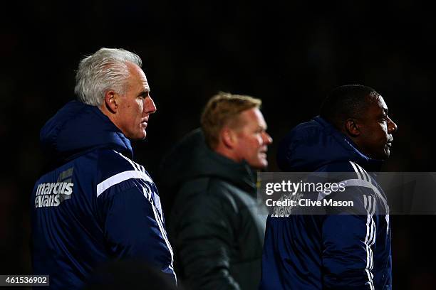 Mick McCarthy, manager of Ipswich looks on next to assistant manager Terry Connor and Ronald Koeman, manager of Southampton during the FA Cup third...