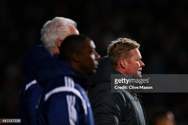 Ronald Koeman, manager of Southampton watches the action on the touchline next to Mick McCarthy, manager of Ipswich and his assistant Terry Connor...