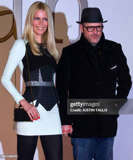 German model Claudia Schiffer and British producer and director Matthew Vaughn pose for pictures on the red carpet as they arrive to attend the world...