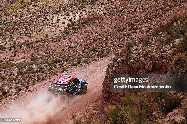 Nani Roma of Spain and Michel Perin of France driving for the ALL4 Racing Mini Monster Energy Rally Raid Team compete near the Salinas Grandes during...