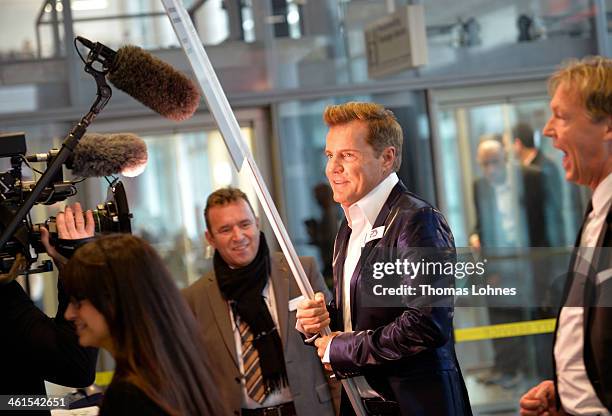 Singer and Entertainer Dieter Bohlen smashs into a signboard for a joke when he enter the fair "Heimtextil 2014" to present his wallpaper collection...