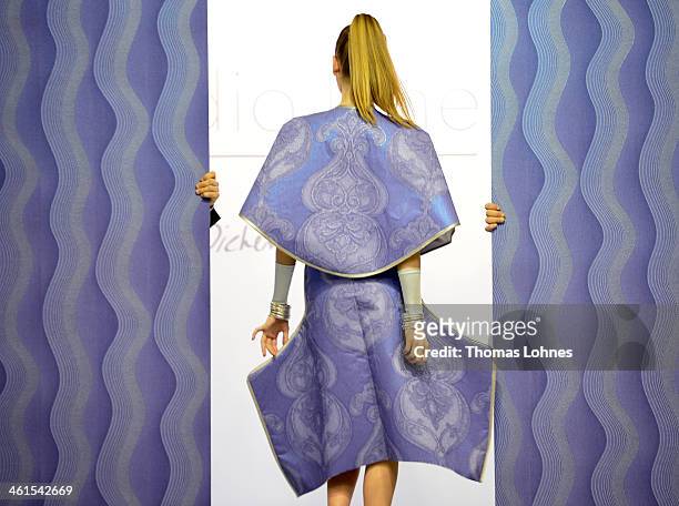 Model presents a wallpapapers outfit at the fair "Heimtextil 2014" on January 9, 2014 in Frankfurt am Main, Germany. Singer and Entertainer Dieter...