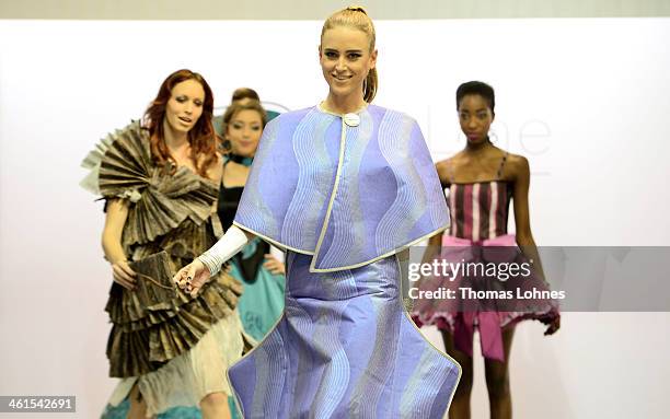 Model presents a wallpapapers outfit at the fair 'Heimtextil 2014' on January 9, 2014 in Frankfurt am Main, Germany. Singer and Entertainer Dieter...
