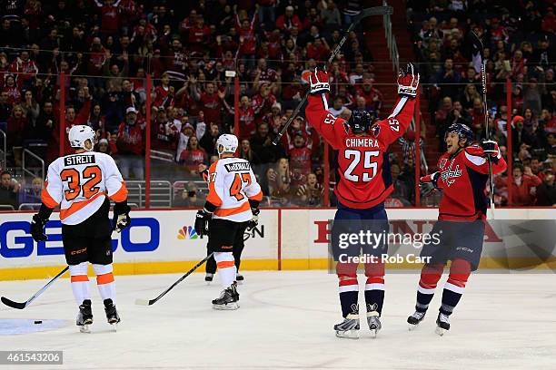 Jason Chimera of the Washington Capitals celebrates his first period goal with teammate Jay Beagle against the Philadelphia Flyers at Verizon Center...