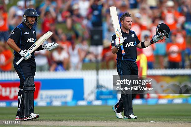 Brendon McCullum of New Zealand celebrates his century as Ross Taylor watches on during the One Day International match between New Zealand and Sri...