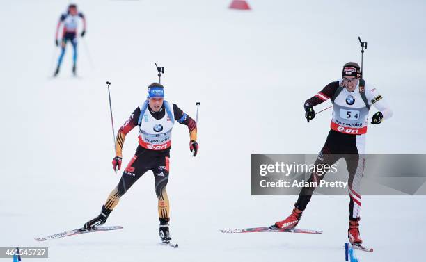 Dominik Landertinger of Austria overtakes Simon Schempp of Germany to win the men's 4x7.5km relay on day two of the E.On IBU World Cup Biathlonon...