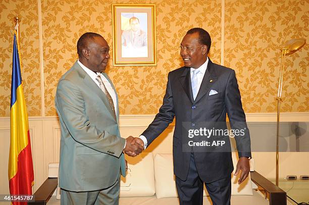 Chadian President Idriss Deby shakes hands with his counterpart from Central Africa Michel Djotodia during the special summit of the 10-nation...