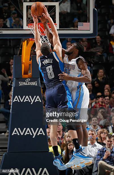 Kenneth Faried of the Denver Nuggets blocks a shot by Dwight Powell of the Dallas Mavericks at Pepsi Center on January 14, 2015 in Denver, Colorado....