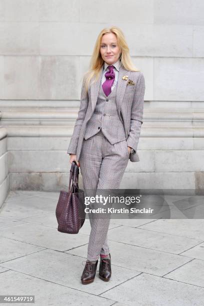 Group Fashion Editor at The Rake, Sarah Ann Murray wears a bespoke suit and shirt, Drakes tie, Bottega Veneta bag and Ralph Lauren shoes day 2 of...