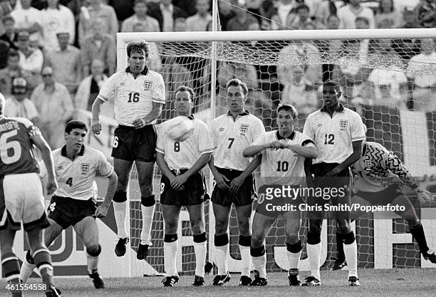 The England defensive wall Martin Keown , Paul Merson , Trevor Steven , David Platt , Gary Lineker and Carlton Palmer face a Danish free-kick during...