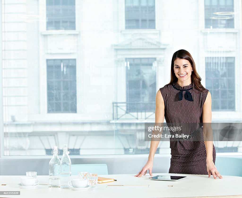 Portrait of modern business woman in white office.