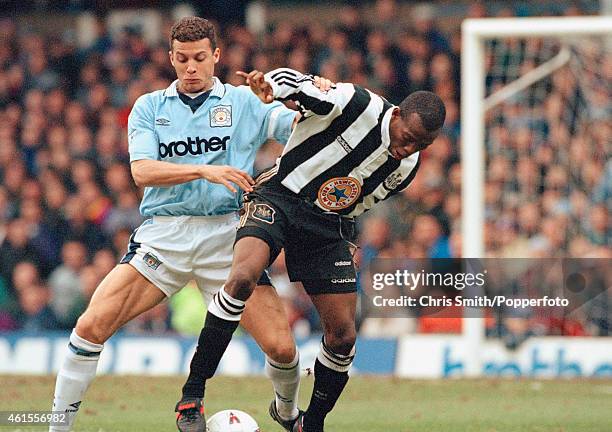 Manchester City defender Keith Curle challenges Newcastle United striker Faustino Asprilla during the FA Premier League match at Maine Road in...