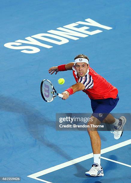 Gilles Muller of Luxembourg plays a backhand in his quarter final match against Bernard Tomic of Australia during day five of the Sydney...