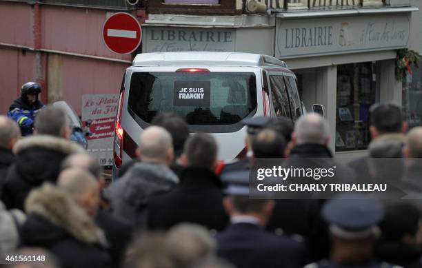 Car carrying the coffin of Franck Brinsolaro, the police officer charged with protecting late Charlie Hebdo editor Stephane Charbonnier , leaves the...