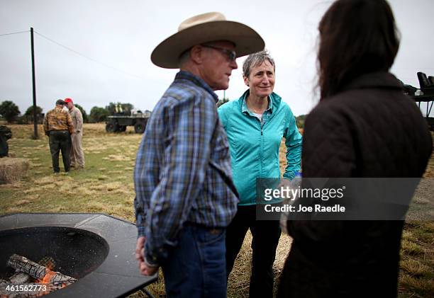 Secretary of the Interior Sally Jewell speaks with Lefty Durando, the owner of Durando Ranch, and others during a visit to meet with ranchers and...