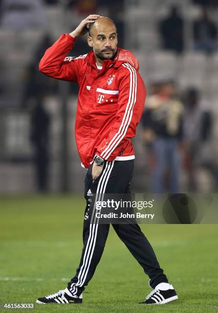 Pep Guardiola of Bayern looks on during the friendly match between Bayern Muenchen and Al Merrikh SC at the Al Sadd Stadium on January 9, 2014 in...